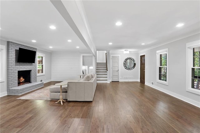 2445 Kings Point Dr, Dunwoody, GA 30338 - living area with plenty of natural light, stairway, a brick fireplace, baseboards, and ornamental molding