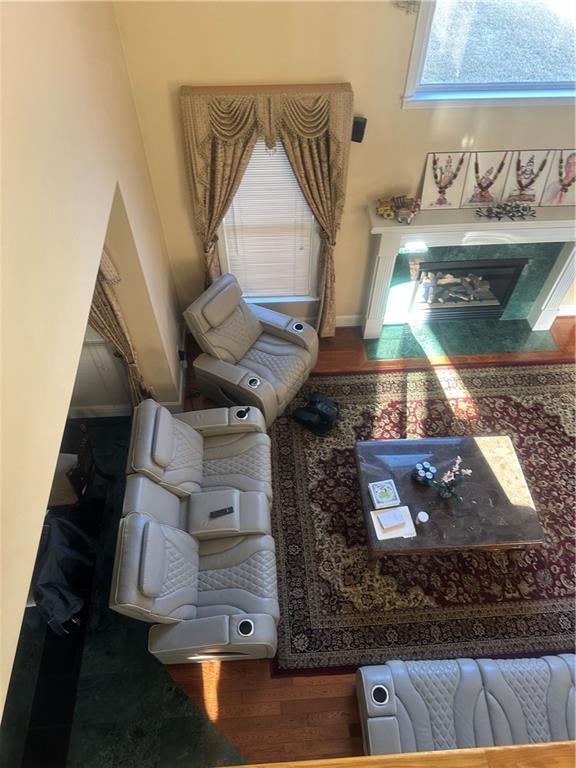 sitting room with wood-type flooring