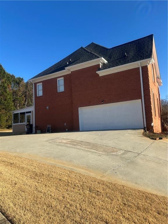 view of side of property featuring a garage