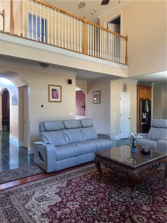 living room featuring a towering ceiling