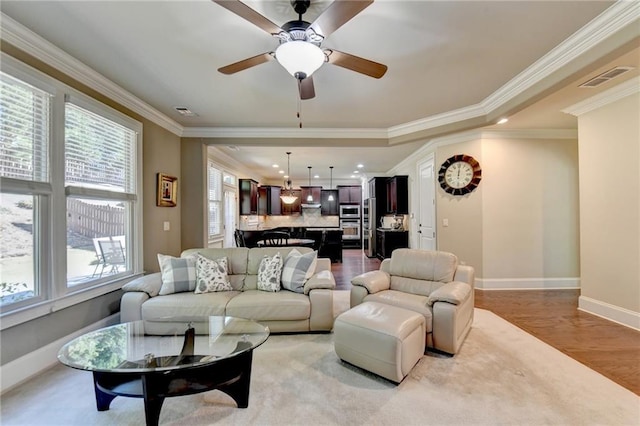 3191 Lake Mcginnis Dr, Suwanee, GA 30024 - living area with baseboards, light wood-type flooring, ornamental molding, ceiling fan, and recessed lighting