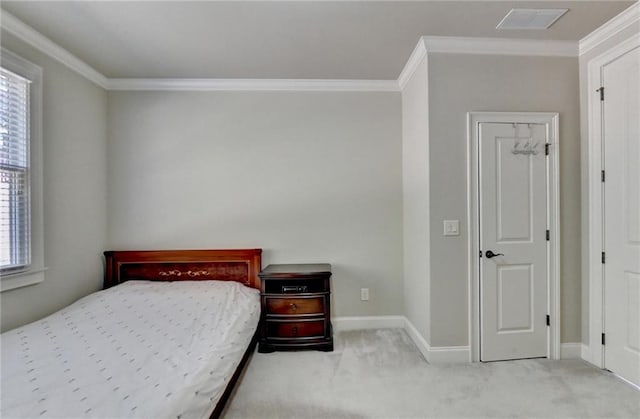 carpeted bedroom featuring crown molding