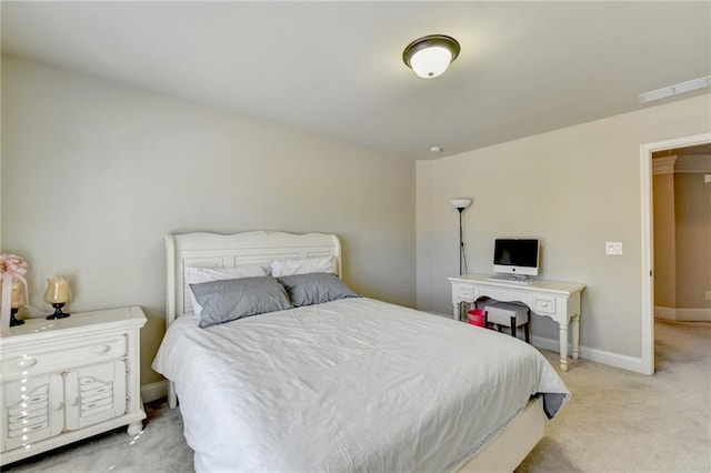 bedroom with light colored carpet