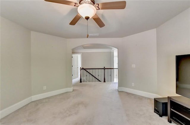 carpeted living room with ceiling fan