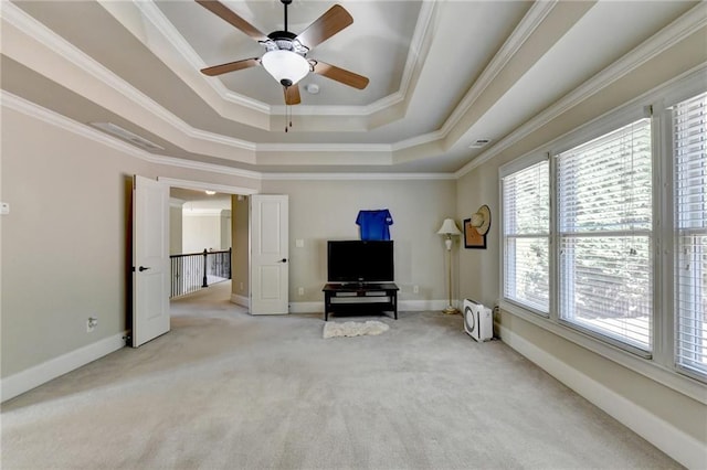 3191 Lake Mcginnis Dr, Suwanee, GA 30024 - living area featuring a raised ceiling, light carpet, a ceiling fan, ornamental molding, and baseboards