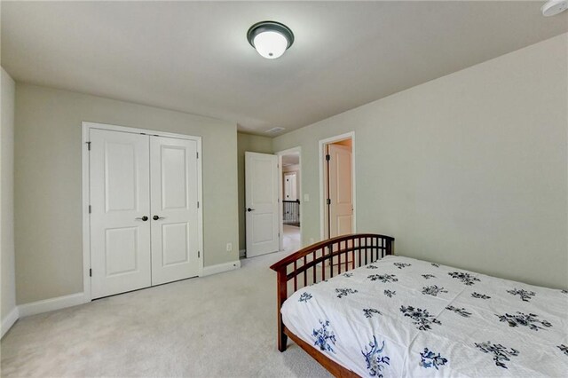 carpeted bedroom featuring a closet