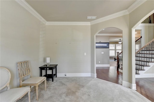 3191 Lake Mcginnis Dr, Suwanee, GA 30024 - living area featuring crown molding, a ceiling fan, arched walkways, stairs, and baseboards
