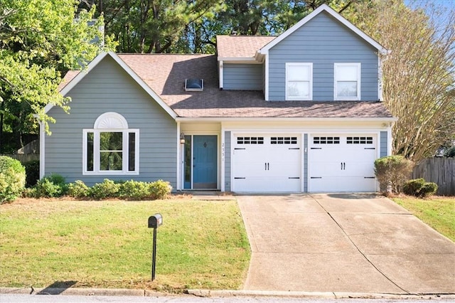 view of front of house with a garage and a front lawn