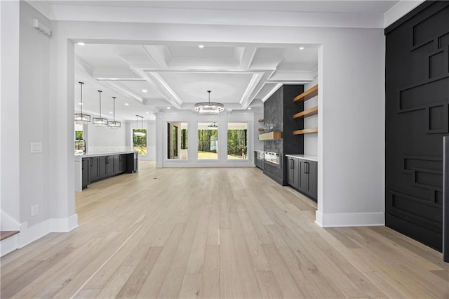 407 Thunder Rd, Buford, GA 30518 - unfurnished living room with coffered ceiling, light wood-type flooring, a chandelier, baseboards, and ornamental molding