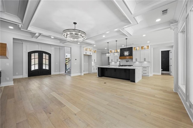 407 Thunder Rd, Buford, GA 30518 - kitchen with a chandelier, light countertops, crown molding, recessed lighting, and white cabinets