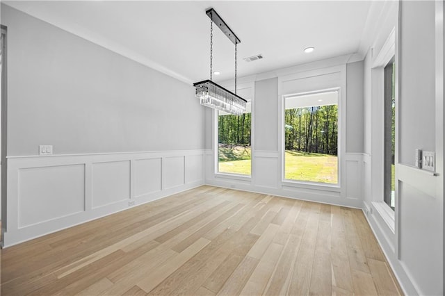 407 Thunder Rd, Buford, GA 30518 - unfurnished dining area with a decorative wall, light wood-style flooring, wainscoting, and recessed lighting