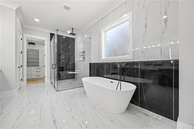 407 Thunder Rd, Buford, GA 30518 - full bathroom featuring a shower stall, a soaking tub, ornamental molding, a spacious closet, and tile walls