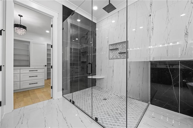 407 Thunder Rd, Buford, GA 30518 - bathroom featuring marble tiled flooring, a marble finish shower, a spacious closet, recessed lighting, and a chandelier