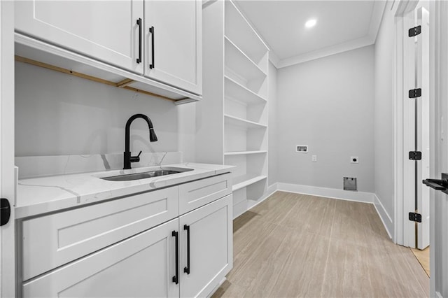 407 Thunder Rd, Buford, GA 30518 - laundry room featuring cabinet space, ornamental molding, light wood finished floors, electric dryer hookup, and baseboards