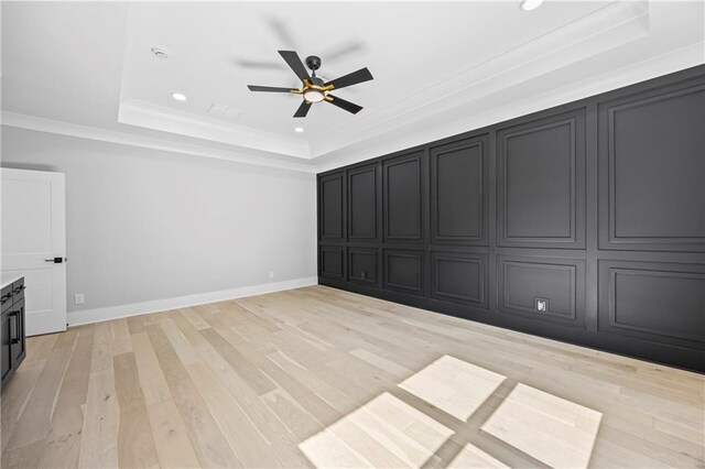 407 Thunder Rd, Buford, GA 30518 - unfurnished living room featuring a tray ceiling, a ceiling fan, light wood finished floors, recessed lighting, and ornamental molding