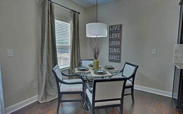 dining room featuring dark hardwood / wood-style flooring