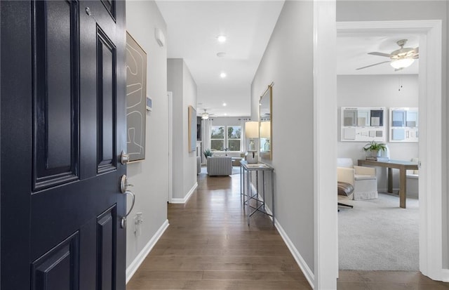 corridor with dark hardwood / wood-style floors