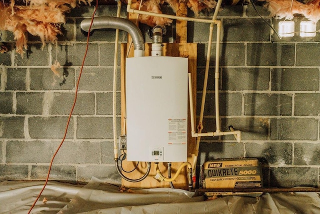 utility room with tankless water heater