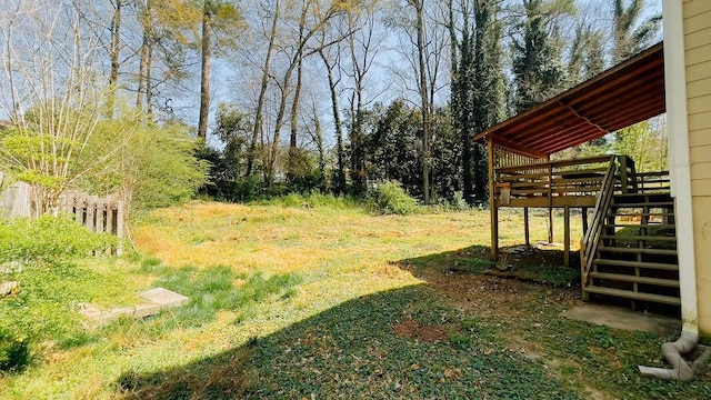 view of yard featuring stairs and a deck