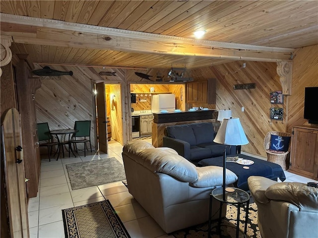 living area with beam ceiling, light tile patterned flooring, wood ceiling, and wooden walls