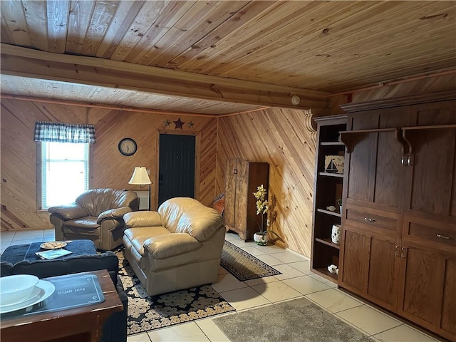 living room featuring wood ceiling, wooden walls, beam ceiling, and light tile patterned floors