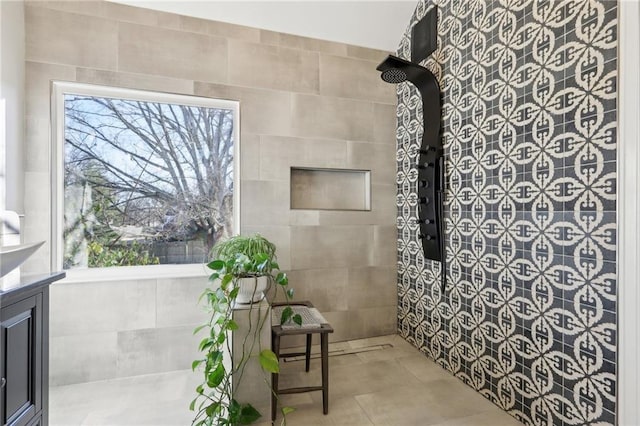 bathroom with tile walls