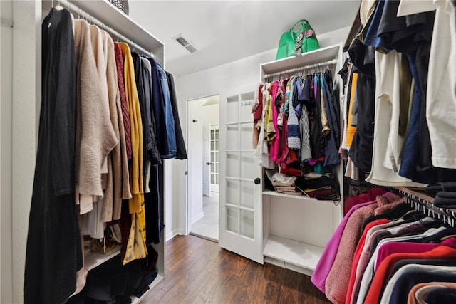 walk in closet featuring dark wood-type flooring