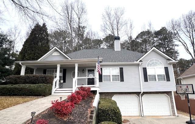 view of front of home with a garage and a porch