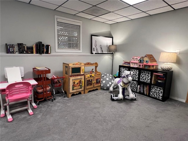 game room with carpet and a drop ceiling
