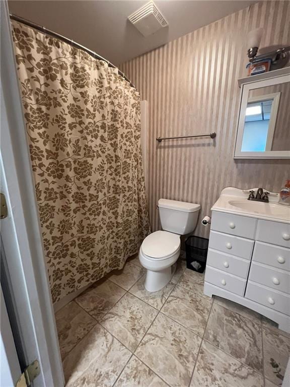 full bathroom with toilet, vanity, wallpapered walls, and curtained shower