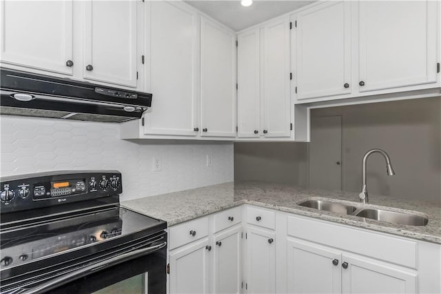 kitchen with black / electric stove, a sink, white cabinetry, and under cabinet range hood