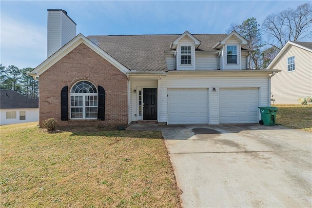 view of front facade featuring concrete driveway, brick siding, a front yard, and a chimney