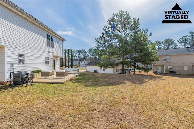 view of yard with an outdoor hangout area, central AC, and a patio area