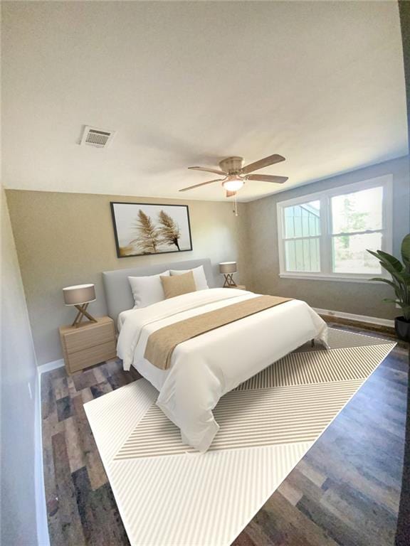 bedroom featuring wood finished floors, baseboards, a ceiling fan, and visible vents
