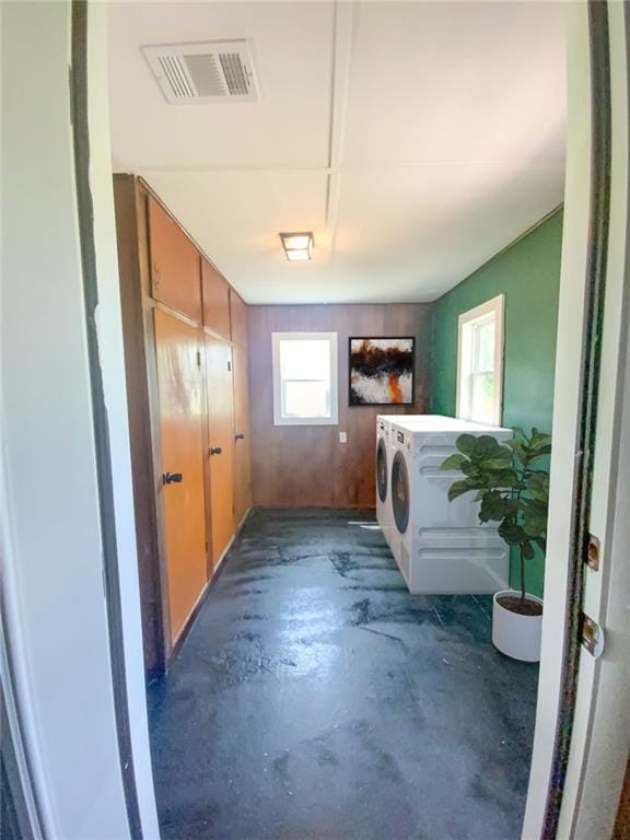 laundry room with visible vents, washer and dryer, and laundry area