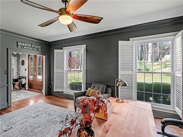 bedroom featuring ceiling fan, ornamental molding, access to exterior, and light wood-type flooring