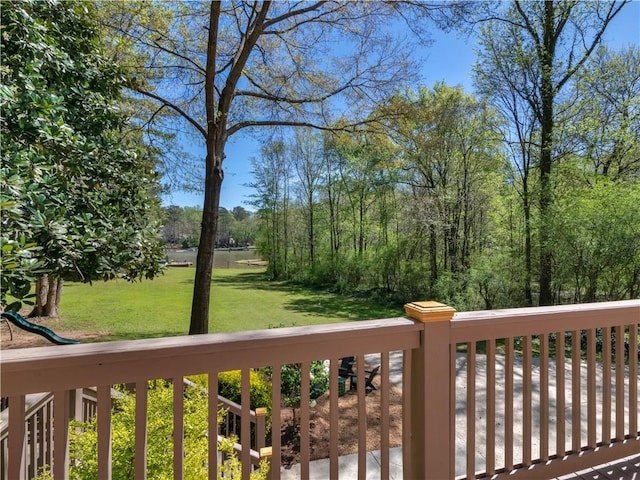 wooden terrace with a yard