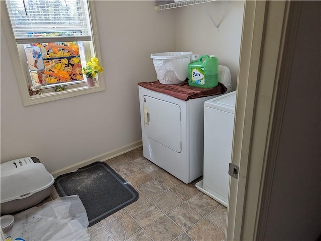 clothes washing area with separate washer and dryer