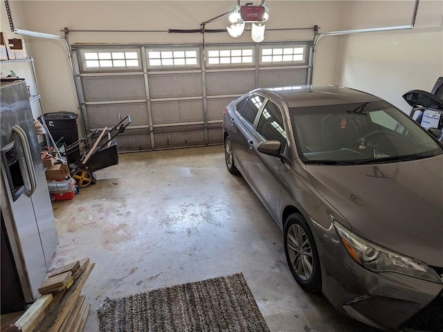 garage featuring a garage door opener