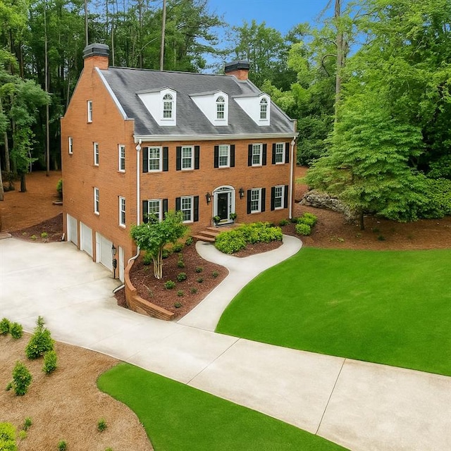 4250 Green Ridge Dr NE, Marietta, GA 30062 - view of front of property featuring a chimney, a garage, driveway, and a front yard