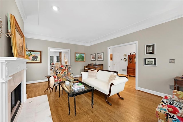 4250 Green Ridge Dr NE, Marietta, GA 30062 - living room with light wood-style flooring, ornamental molding, a fireplace with flush hearth, and recessed lighting