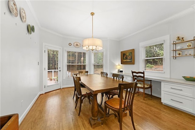 4250 Green Ridge Dr NE, Marietta, GA 30062 - dining space with crown molding, light wood finished floors, and a chandelier