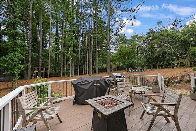 4250 Green Ridge Dr NE, Marietta, GA 30062 - wooden terrace with an outdoor fire pit and a grill