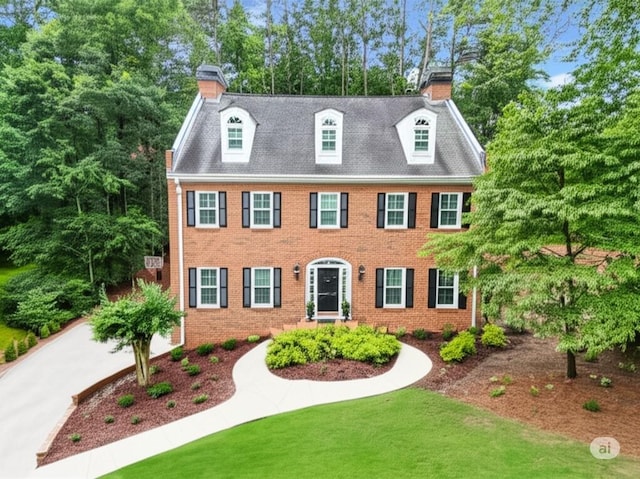 4250 Green Ridge Dr NE, Marietta, GA 30062 - view of front of property with a chimney, brick siding, a front lawn, and view of scattered trees