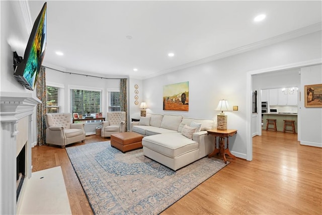 4250 Green Ridge Dr NE, Marietta, GA 30062 - living room with a fireplace with flush hearth, ornamental molding, light wood-type flooring, and recessed lighting
