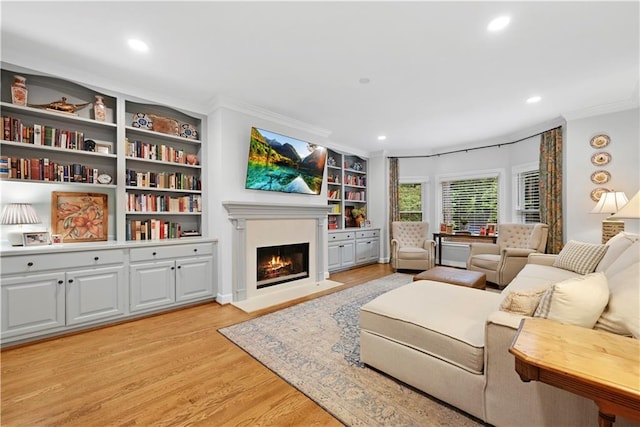 4250 Green Ridge Dr NE, Marietta, GA 30062 - living room with ornamental molding, light wood-style flooring, a fireplace with flush hearth, recessed lighting, and built in shelves
