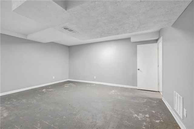 empty room featuring a textured ceiling