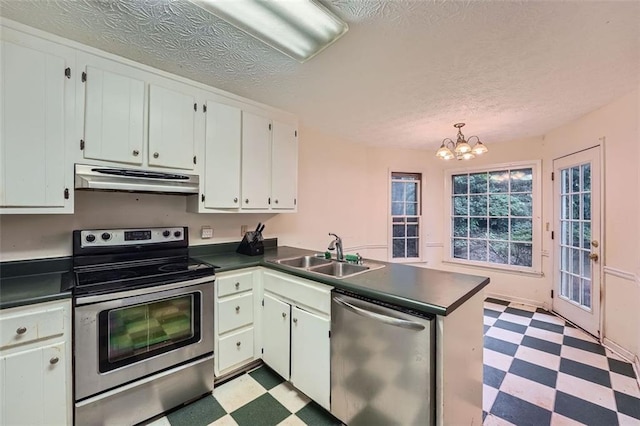 2867 Holly Oaks Dr, Marietta, GA 30062 - kitchen with stainless steel appliances, light flooring, dark countertops, under cabinet range hood, and a textured ceiling