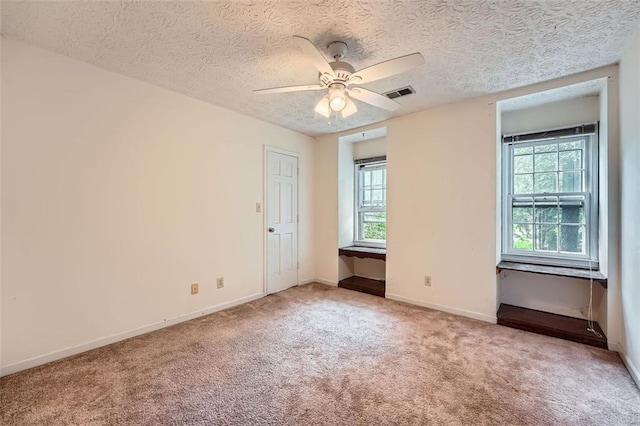 2867 Holly Oaks Dr, Marietta, GA 30062 - spare room with plenty of natural light, carpet, a ceiling fan, and a textured ceiling