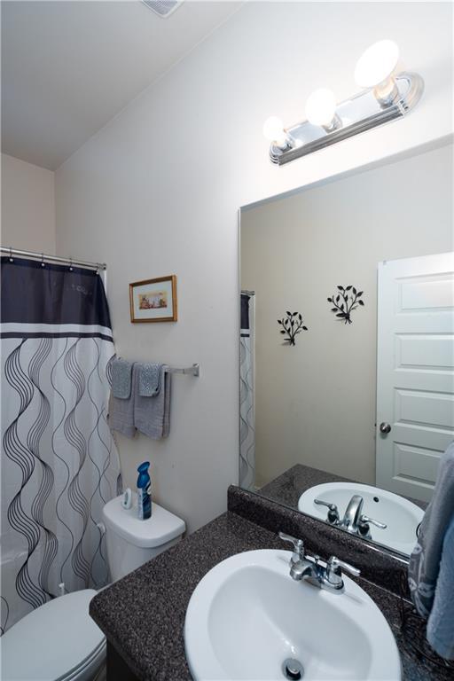 bathroom with vanity and toilet